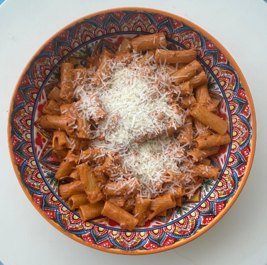 A creamy pasta alla vodka topped with a generous sprinkle of parmesan cheese